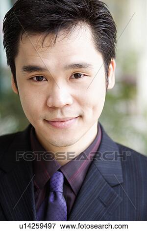 Portrait of a businessman grinning View Large Photo Image Stock Photo - Portrait of a businessman grinning. Fotosearch