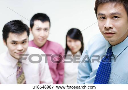 Portrait of business executives standing together View Large Photo Image Stock Photo - Portrait of business executives standing together. Fotosearch