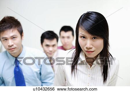 Portrait of business executives standing together View Large Photo Image Stock Photograph - Portrait of business executives standing together. Fotosearch
