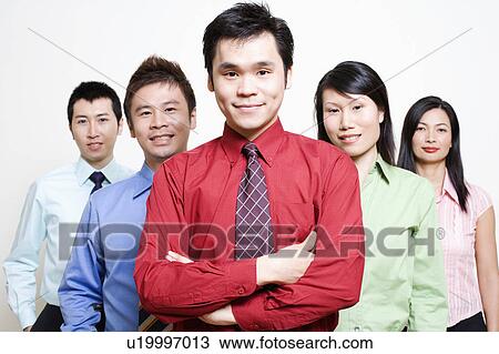 Portrait of five business executives standing together and smiling View Large Photo Image Stock Image - Portrait of five business executives standing together and smiling. Fotosearch