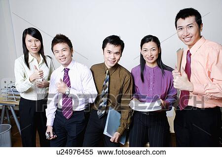 Portrait of five business executives standing and smiling together View Large Photo Image Stock Photography - Portrait of five business executives standing and smiling together. Fotosearch