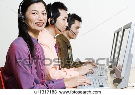Three customer service representatives working on computers View Large Photo Image Stock Image - Three customer service representatives working on computers. Fotosearch