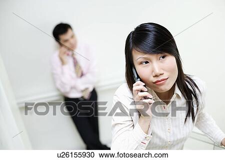 Close-up of a businesswoman talking on a mobile phone View Large Photo Image Stock Image - Close-up of a businesswoman talking on a mobile phone. Fotosearch