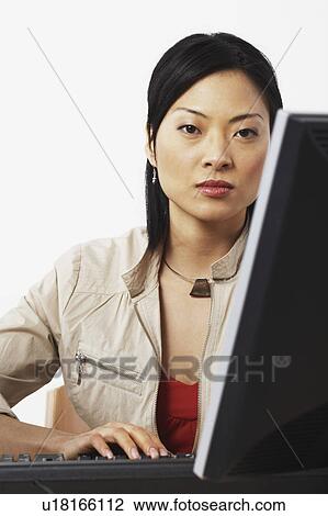 Portrait of a businesswoman using a computer View Large Photo Image Stock Image - Portrait of a businesswoman using a computer. Fotosearch