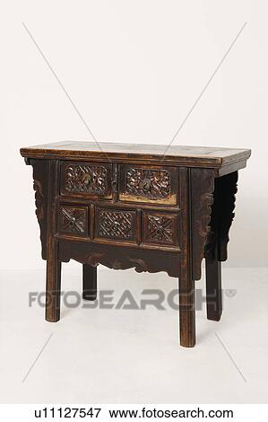 Stock Photo - Close-up of a wooden side table. Fotosearch