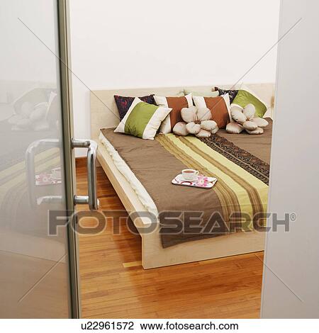 Tea cup and a tray on the bed View Large Photo Image Stock Image - Tea cup and a tray on the bed. Fotosearch