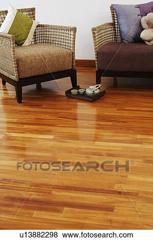 Teapot and tea cups with a tray on a hardwood floor View Large Photo Image Stock Photo - Teapot and tea cups with a tray on a hardwood floor. Fotosearch