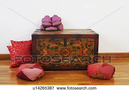 Trunk and cushions on a hardwood floor View Large Photo Image Stock Photo - Trunk and cushions on a hardwood floor. Fotosearch