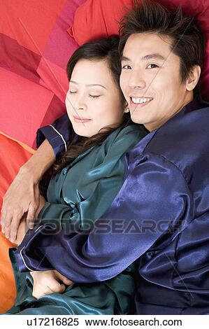 Close-up of a couple hugging View Large Photo Image Stock Photography - Close-up of a couple hugging. Fotosearch