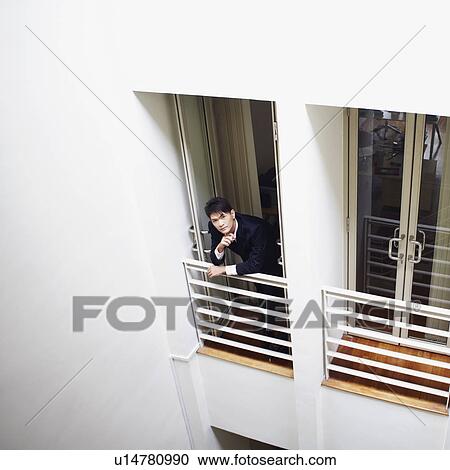 High angle view of a businessman standing at the doorway in an office View Large Photo Image Stock Image - High angle view of a businessman standing at the doorway in an office. Fotosearch