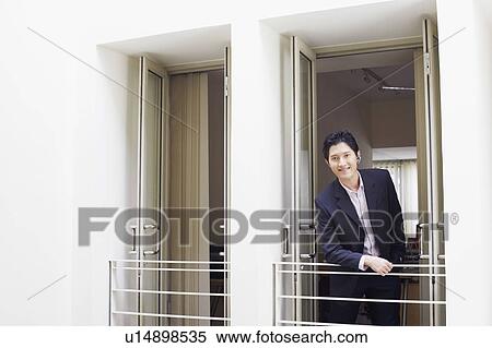 Stock Photography - Portrait of a businessman smiling. Fotosearch