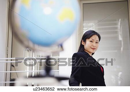 Portrait of a businesswoman smiling View Large Photo Image Stock Image - Portrait of a businesswoman smiling. Fotosearch