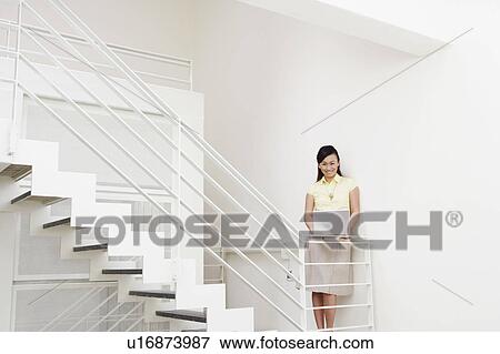 Portrait of a young woman smiling View Large Photo Image Stock Photo - Portrait of a young woman smiling. Fotosearch