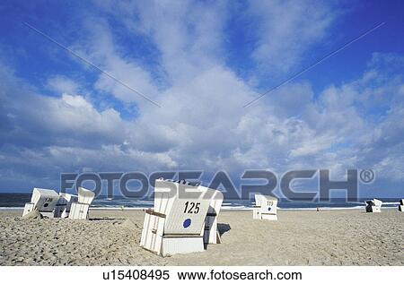 Stock Photography - chair, bad, blue, beach chair, beach, cloud, abandoned. Fotosearch