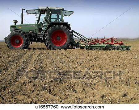 Discing the fields with a tractor View Large Photo Image Stock Image - Discing the fields with a tractor. Fotosearch