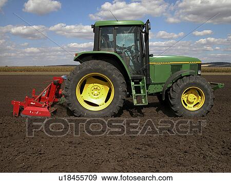 Stock Photo - Tractor and disc. Fotosearch