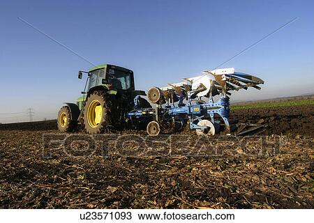 Tractor tilling the land View Large Photo Image Stock Image - Tractor tilling the land. Fotosearch