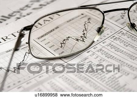 Stock Photo - Glass sitting on a stock paper. Fotosearch