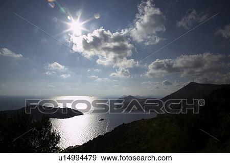 Stock Photo - clouds, back light, buck, boat, bay, atmosphere. Fotosearch