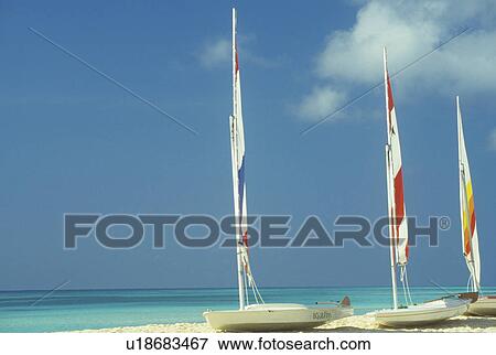 Sailboats on the beach View Large Photo Image Stock Photo - Sailboats on the beach. Fotosearch