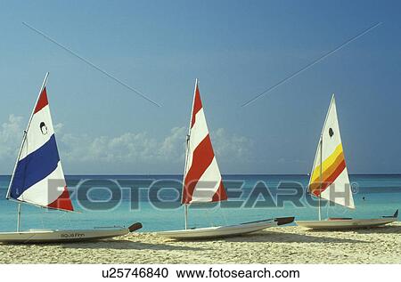 Small sailboats on sandy beach View Large Photo Image Stock Image - Small sailboats on sandy beach. Fotosearch
