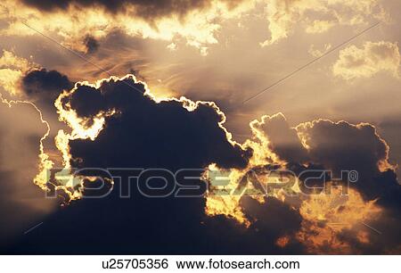 Stock Photograph - lichtstimmung, wolkenstimmung, austria, burgenland, calf, clouds, kichtstrahlen. Fotosearch
