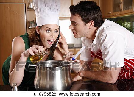 A couple cooking together View Large Photo Image Stock Photography - A couple cooking together. Fotosearch