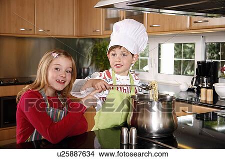 Children cooking spaghetti View Large Photo Image Picture - Children cooking spaghetti. Fotosearch