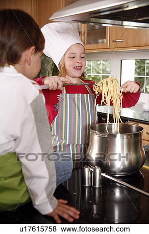 Children cooking spaghetti View Large Photo Image Stock Photo - Children cooking spaghetti. Fotosearch