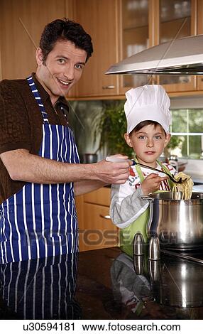 Father and son cooking spaghetti View Large Photo Image Stock Image - Father and son cooking spaghetti. Fotosearch