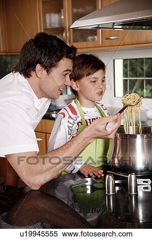 Father and son cooking spaghetti View Large Photo Image Stock Photography - Father and son cooking spaghetti. Fotosearch