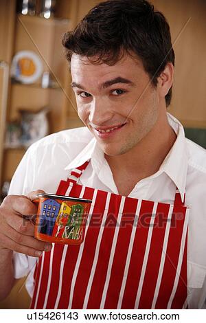 Stock Image - Man enjoying a cup of coffee. Fotosearch