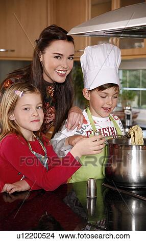 Picture - Mother and children cooking . Fotosearch