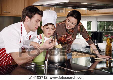 Parents and son cooking spaghetti View Large Photo Image Stock Image - Parents and son cooking spaghetti. Fotosearch