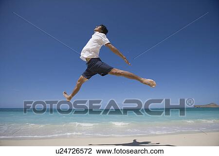 Stock Image - Profile of a young man jumping. Fotosearch