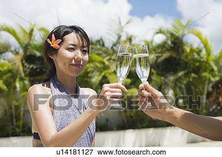 A woman toasting wineglass View Large Photo Image Stock Photo - A woman toasting wineglass. Fotosearch