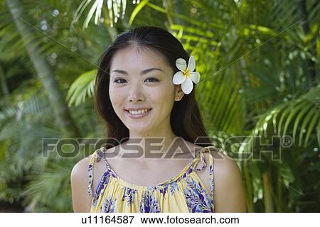 Stock Photo - Portrait of a happy young woman. Fotosearch