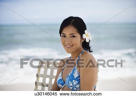 Portrait of a woman sitting at beach View Large Photo Image Stock Photography - Portrait of a woman sitting at beach. Fotosearch