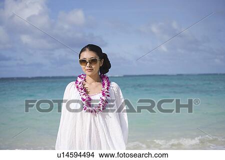 Portrait of a young woman at beach View Large Photo Image Picture - Portrait of a young woman at beach. Fotosearch