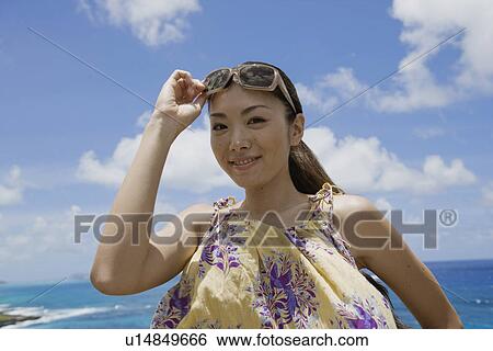 Portrait of a young woman smiling View Large Photo Image Stock Photograph - Portrait of a young woman smiling. Fotosearch