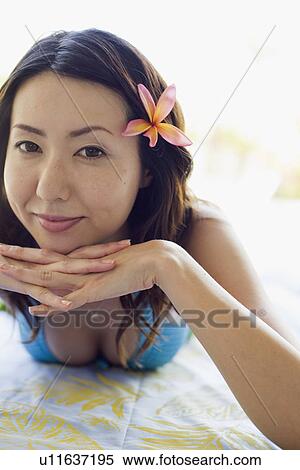 Stock Photography - Portrait of young woman smiling. Fotosearch