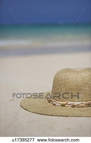 Close-up of a hat on sand View Large Photo Image Stock Photo - Close-up of a hat on sand. Fotosearch