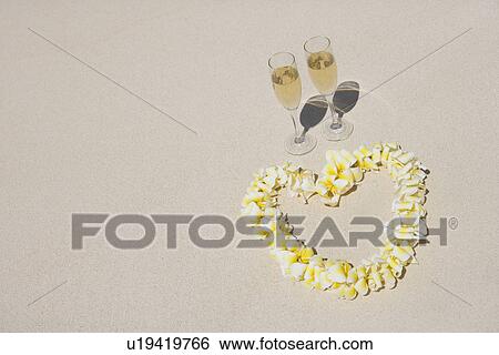 Elevated view of wineglasses and heart-shaped garland View Large Photo Image Stock Photograph - Elevated view of wineglasses and heart-shaped garland. Fotosearch
