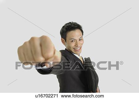 Stock Image - Man posing for the camera, portrait. Fotosearch