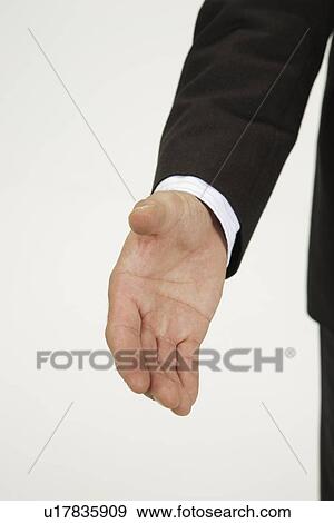 Man extending his palm, portrait View Large Photo Image Stock Photo - Man extending his palm, portrait. Fotosearch