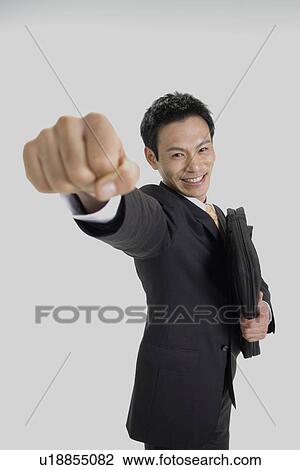 Stock Image - Man posing for the camera, portrait. Fotosearch