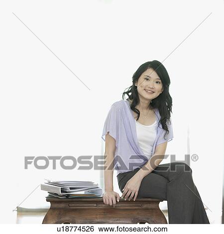 Stock Photograph - Portrait of a businesswoman smiling. Fotosearch