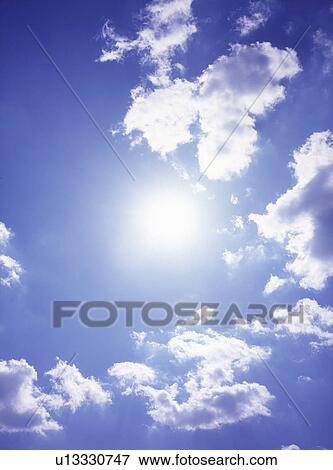Stock Photo - View of blue sky with clouds. Fotosearch