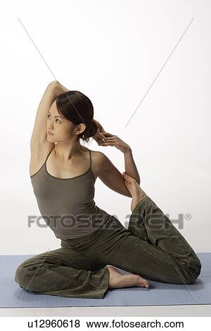 View of a young woman in bowstring position View Large Photo Image Stock Photo - View of a young woman in bowstring position. Fotosearch