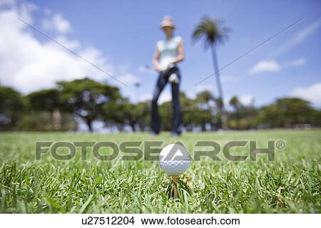 A golf ball placed on grass View Large Photo Image Picture - A golf ball placed on grass. Fotosearch